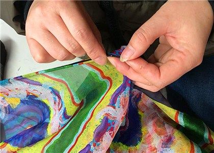 Hand rolled hems for the luxury custom printed silk bandana scarves